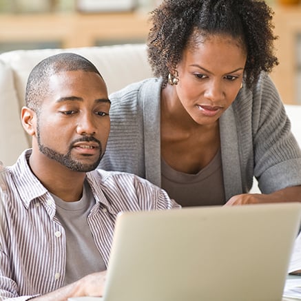 Couple looking at laptop computer