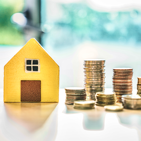 Yellow House with coins on table